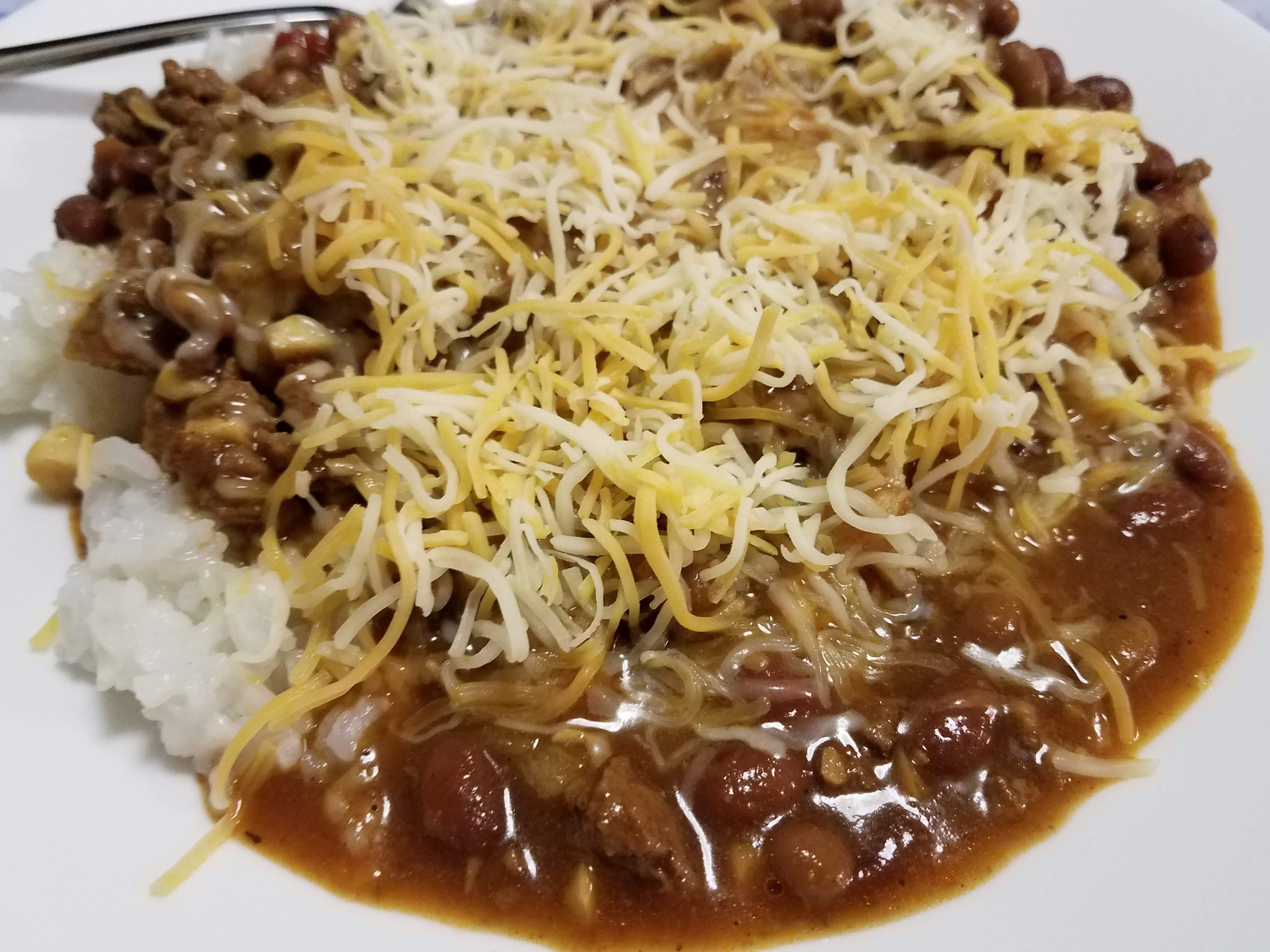 Chili with rice and cheese
